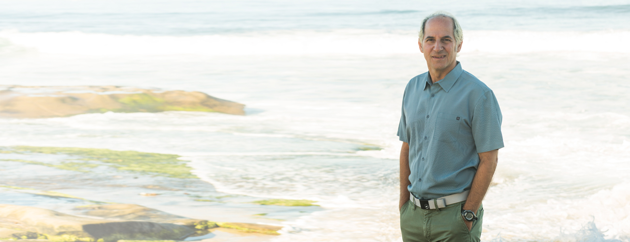 Man standing in front of ocean